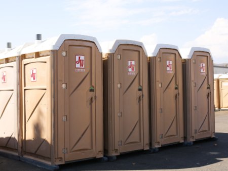JW Porta Potties Lined Up (Our Services thumbnail) Row of JW Enterprises portable restrooms