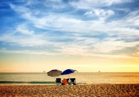 Beach umbrellas on the sand at Carpinteria State Beach in Carpinteria, California