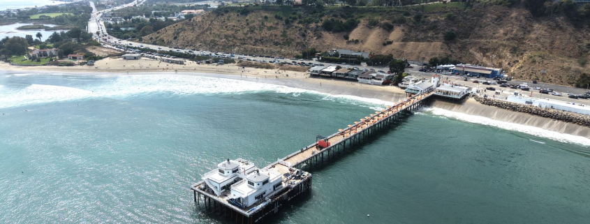 Aerial view of the Malibu Pier and coastline along Pacific Coast Highway
